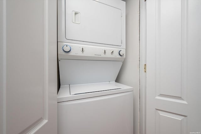 laundry room with stacked washer and clothes dryer