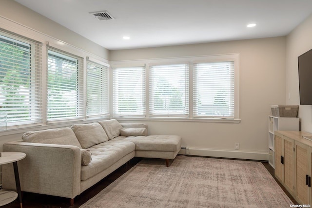 living room featuring a baseboard heating unit