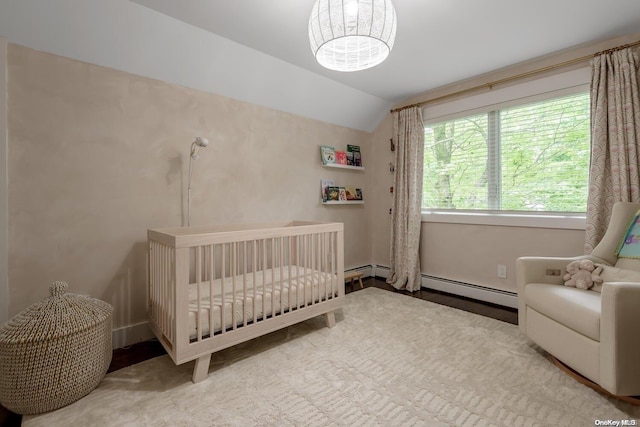 bedroom with lofted ceiling and a crib