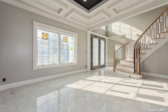 entryway with beamed ceiling, a high ceiling, and coffered ceiling