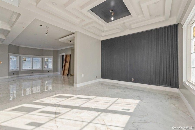 spare room featuring coffered ceiling and ornamental molding