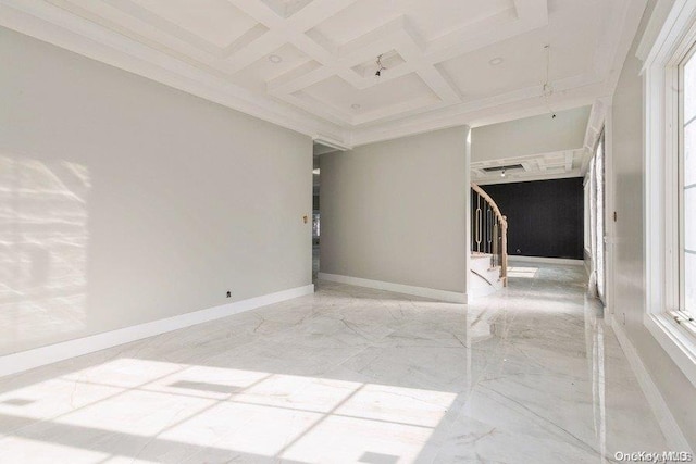 empty room with crown molding, beamed ceiling, and coffered ceiling