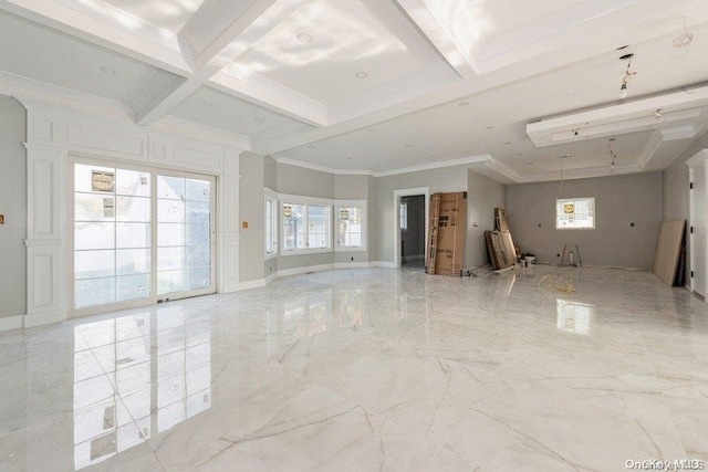 spare room featuring beamed ceiling, crown molding, and coffered ceiling