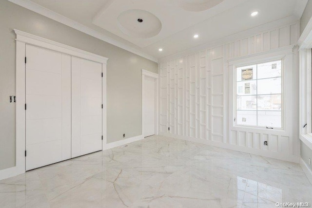 unfurnished bedroom featuring crown molding