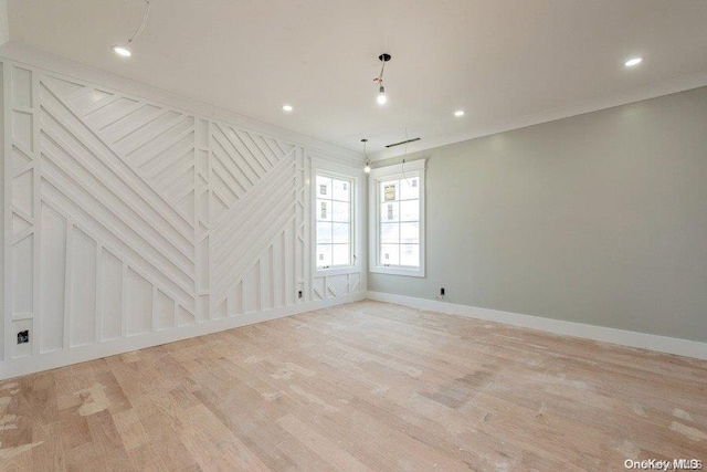 spare room featuring light hardwood / wood-style flooring