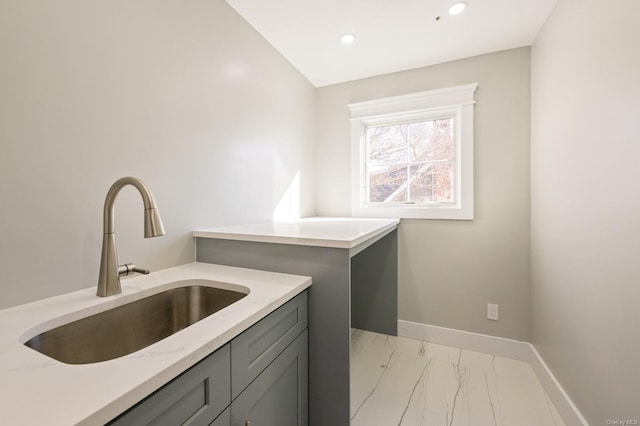 clothes washing area featuring sink