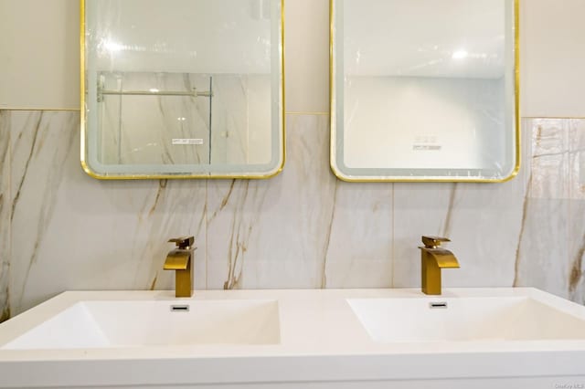 bathroom featuring tile walls, vanity, and walk in shower