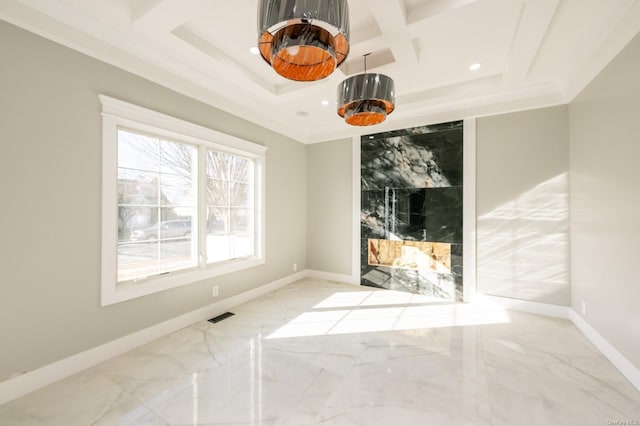 empty room with coffered ceiling and beamed ceiling