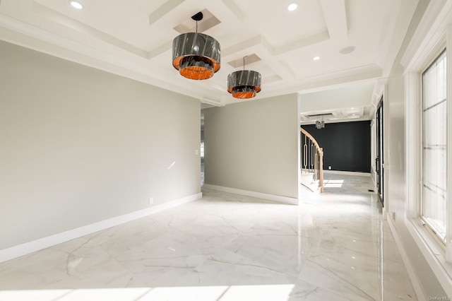 empty room with coffered ceiling, beamed ceiling, and a healthy amount of sunlight