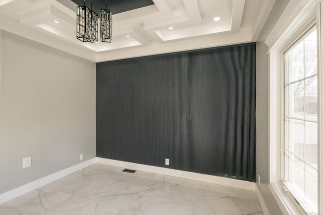 empty room featuring an inviting chandelier