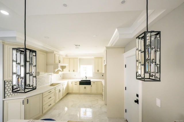 interior space with sink and backsplash