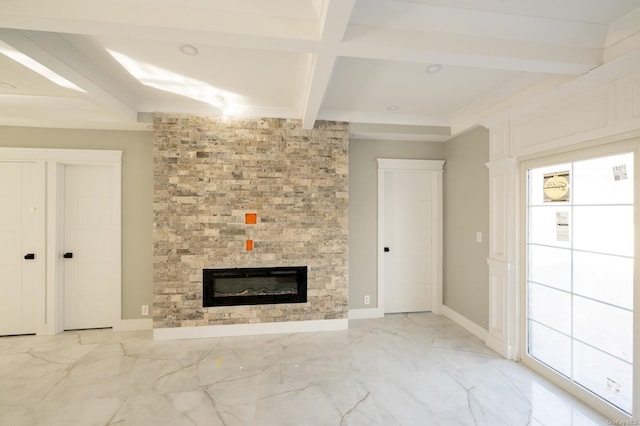 unfurnished living room with beam ceiling, a large fireplace, and coffered ceiling