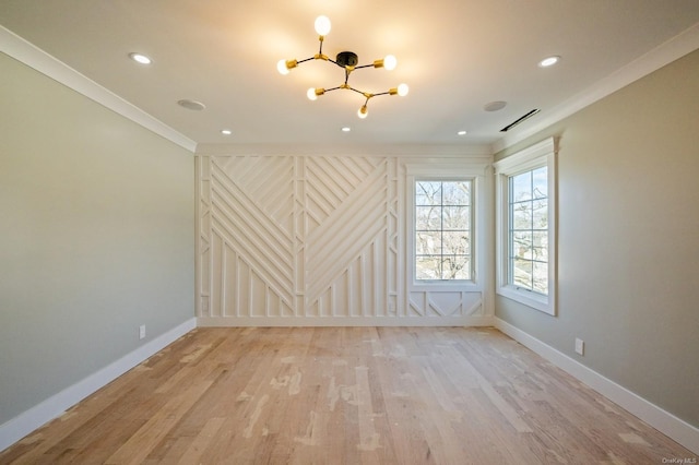 spare room with light hardwood / wood-style flooring and ornamental molding