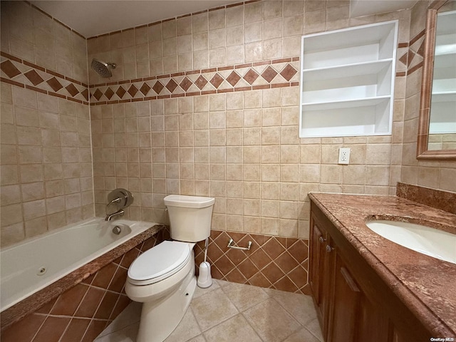 full bathroom featuring vanity, tiled shower / bath, tile patterned flooring, toilet, and tile walls