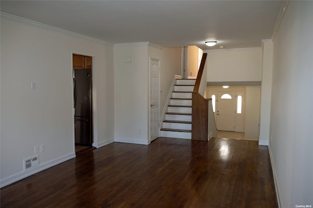 entrance foyer featuring dark hardwood / wood-style floors and ornamental molding