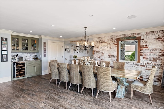 dining room featuring dark hardwood / wood-style floors, crown molding, beverage cooler, brick wall, and a chandelier