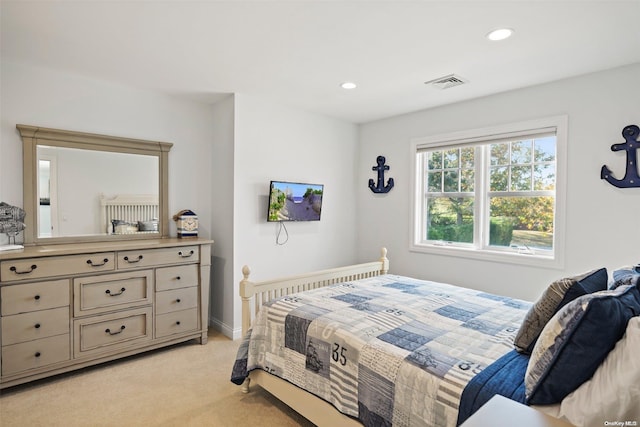 bedroom featuring light colored carpet