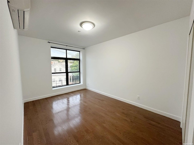 empty room featuring dark hardwood / wood-style floors