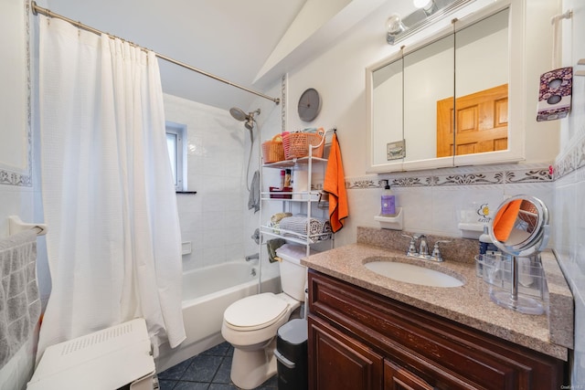 full bathroom with tile patterned flooring, shower / bath combination with curtain, toilet, vanity, and tile walls