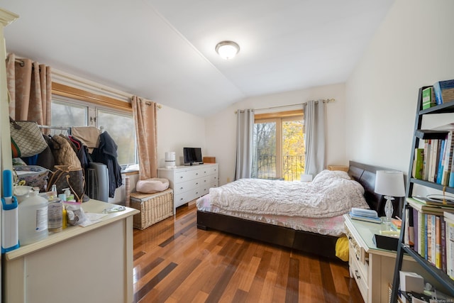 bedroom featuring hardwood / wood-style floors and lofted ceiling