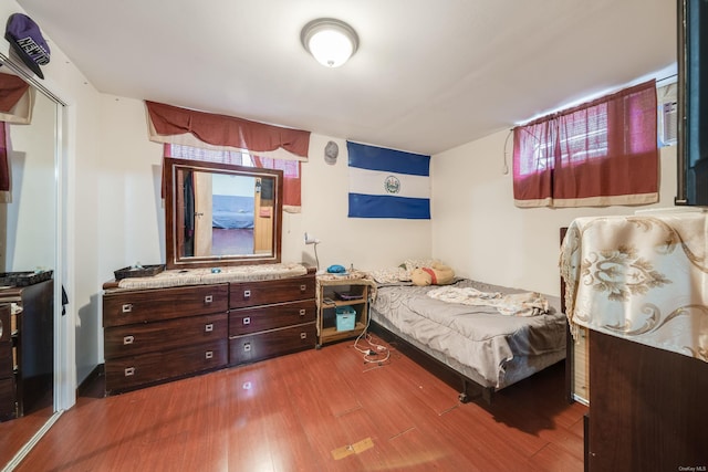 bedroom with hardwood / wood-style floors