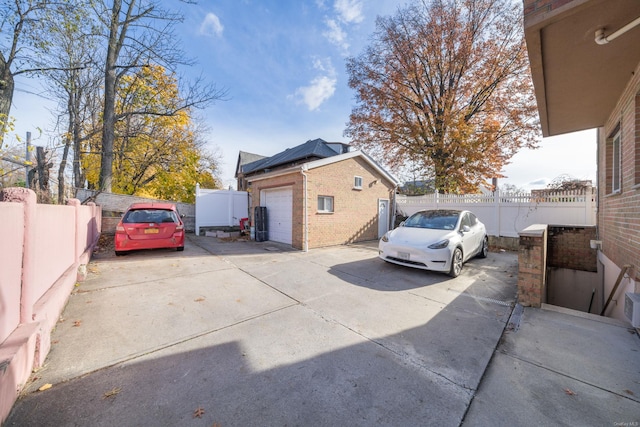 view of property exterior featuring an outbuilding and a garage