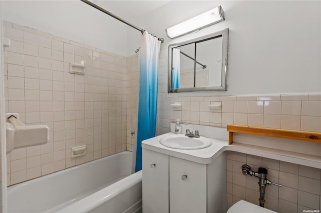 full bathroom with shower / bath combination with curtain, toilet, tile walls, and vanity