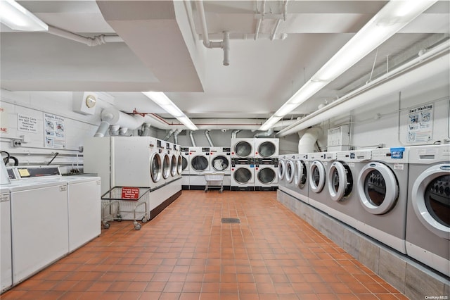 laundry room with washer and dryer and stacked washer / drying machine