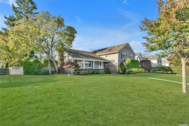 view of front of property with a front lawn