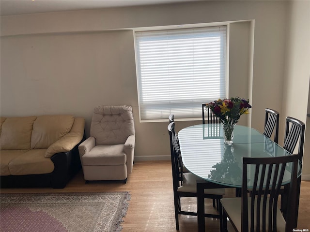 dining space featuring light hardwood / wood-style floors