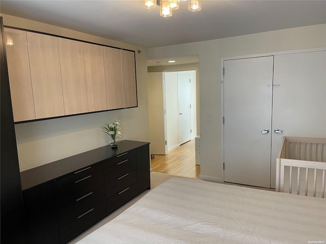 bedroom featuring a closet and light hardwood / wood-style flooring