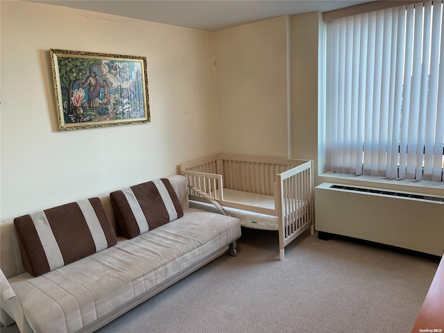 carpeted bedroom featuring radiator heating unit