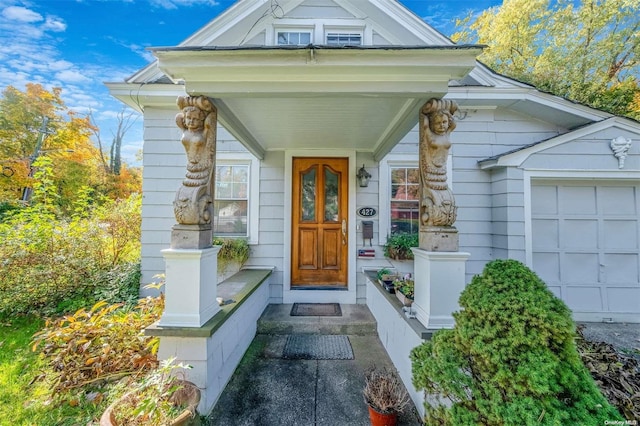 entrance to property featuring a porch