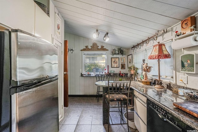 kitchen with stainless steel refrigerator, dishwasher, wooden ceiling, tile patterned floors, and lofted ceiling