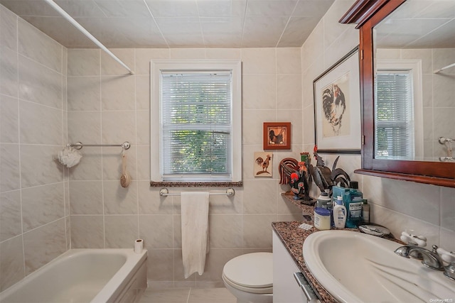 full bathroom with shower / bathing tub combination, vanity, toilet, and tile walls