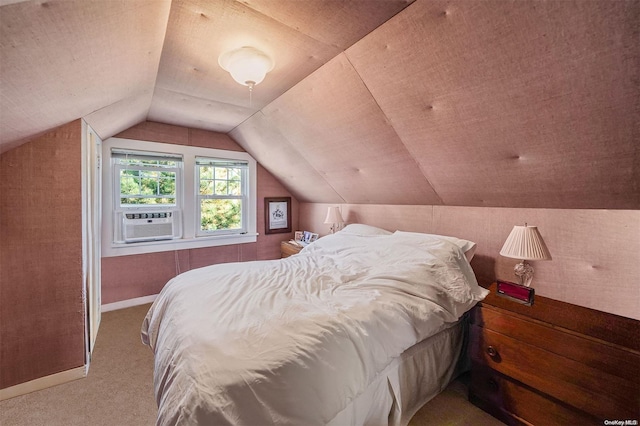 bedroom with light carpet, vaulted ceiling, and cooling unit