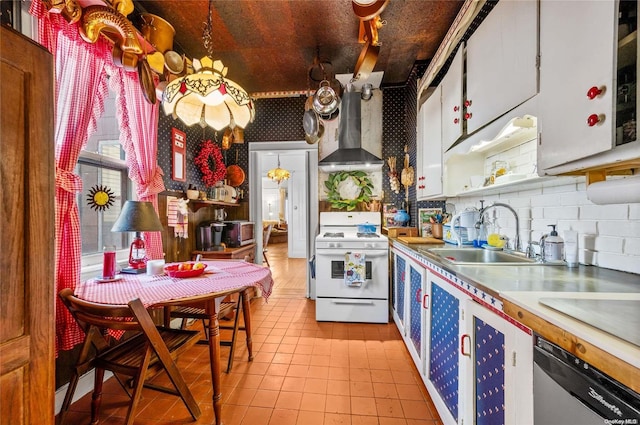 kitchen with sink, stainless steel appliances, wall chimney range hood, decorative backsplash, and white cabinets