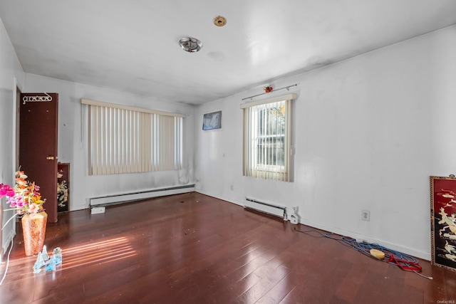 unfurnished room with a baseboard radiator and hardwood / wood-style flooring