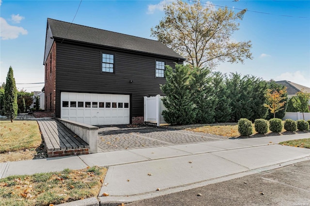 view of front of property with a garage