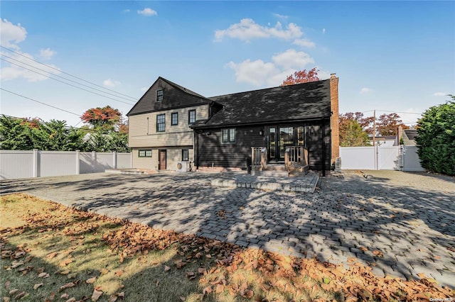 back of property featuring a patio area