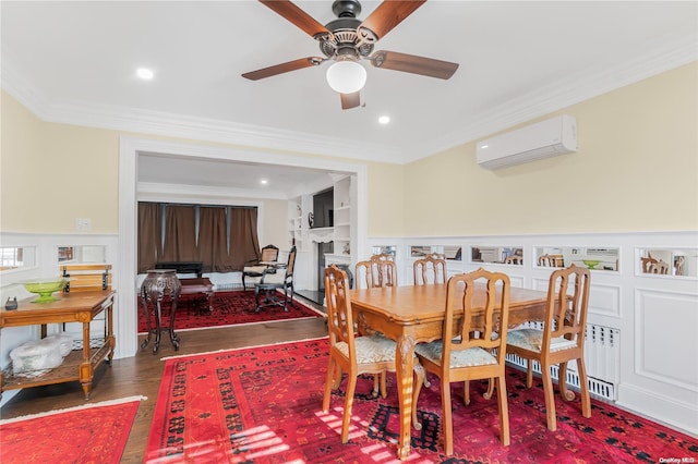 dining area with a wall mounted air conditioner, crown molding, dark hardwood / wood-style floors, ceiling fan, and built in features