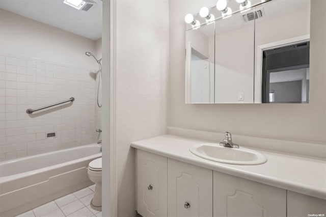 full bathroom with tile patterned floors, vanity, toilet, and tiled shower / bath