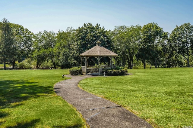 surrounding community with a gazebo and a lawn