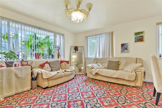 living room with a wealth of natural light and a notable chandelier