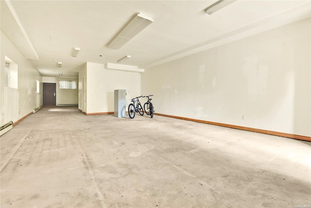 garage with a baseboard heating unit