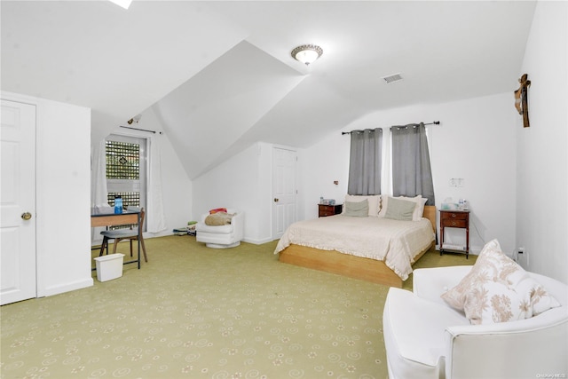 bedroom with lofted ceiling