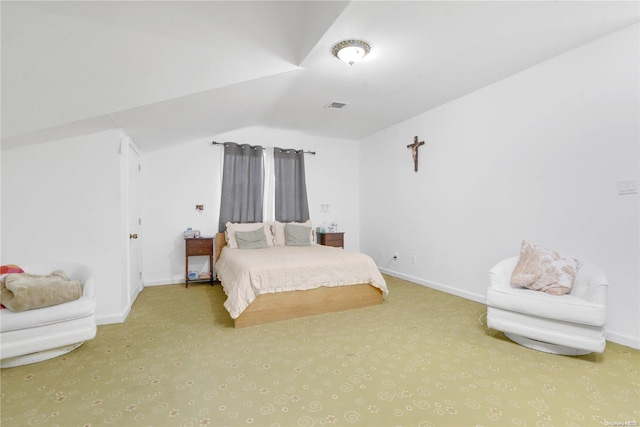 bedroom featuring lofted ceiling