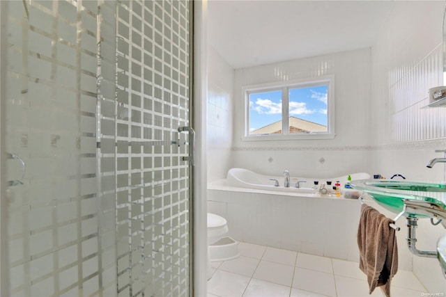 bathroom featuring tile patterned floors, independent shower and bath, and toilet