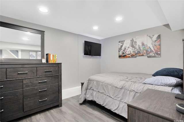 bedroom with light hardwood / wood-style flooring