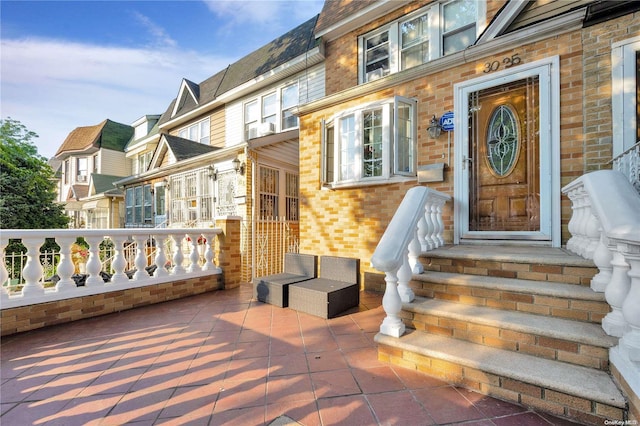 doorway to property with a patio